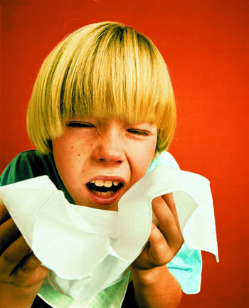 Boy Sneezing into Handkerchief