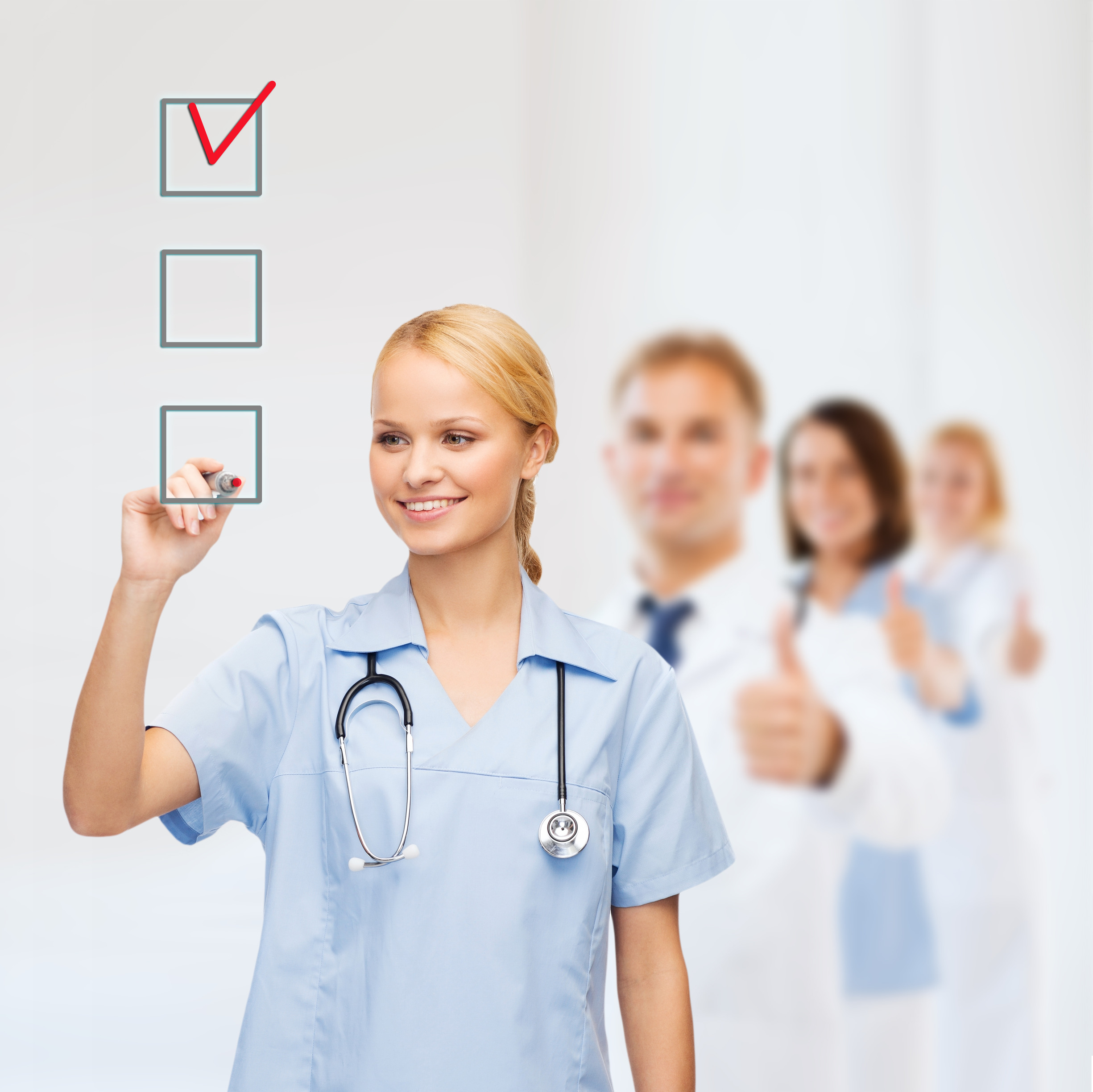 doctor or nurse drawing checkmark into checkbox